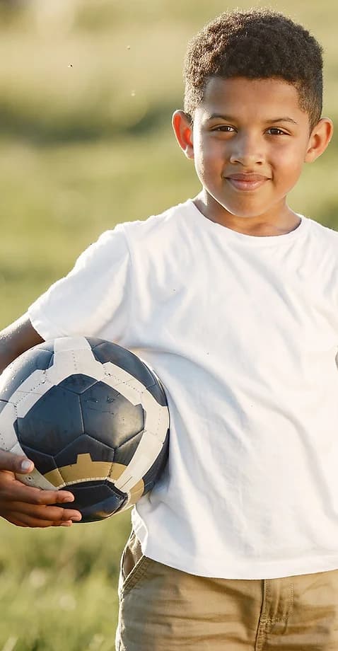 kid holding a football